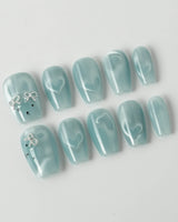 Thump Bunny_Macaron handmade press-ons with soft blue shimmer and heart magnet effect