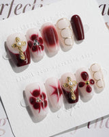 Tip Burgundy Nails in short coffin shape with glossy red tips and ornate fall nail art
