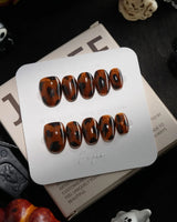 Tortoise handmade press-on nails in extra short oval shape by Joyee Nails