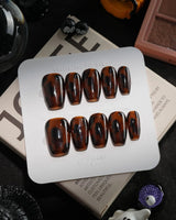 Tortoise handmade press-on nails in short coffin shape by Joyee Nails