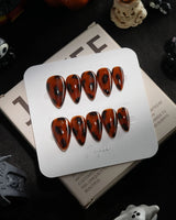 Tortoise handmade press-on nails in short stiletto shape by Joyee Nails