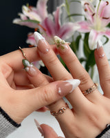 Duchess Olive press-ons with olive green gel color, 3D flowers, and glossy French tips
