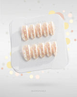 Lemon soda press-on nails with pearly aurora nude base and retro milky white polka dots