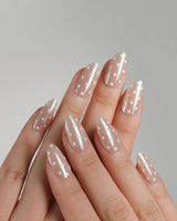 Lemon soda press-on nails with vanilla yellow tones, pearly nude shimmer and retro polka dots
