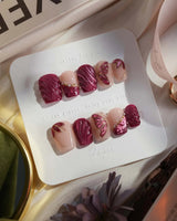 Velvet Flow extra short coffin press-on nails with red cat-eye shimmer and butterfly wings