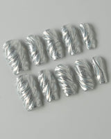 Velvet Frost press-on nails in medium square shape — 3D Spiral Texture, Silver Glitter Effect.