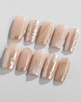 Venus medium square nails with pearl nude color, shell art, and gold accents