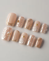 Venus short square press-on nails with pearl nude base and 3D shell details
