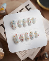 Wildflower press-on nails in extra short oval shape — Fresh Creamy White, Colorful Metallic Dainty Florals & Gold Wire Stems.
