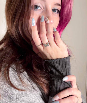 Winter wonderland handmade press-on nails featuring Icy Blue Snowflakes, Rhinestone Wreath & Hearts.