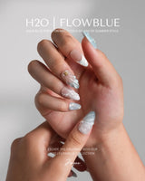 Yasawa Blue close-up of pearly blue-white nails with 3D shells and gold starfish charms