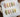 Cottagecore press-on nails featuring hand-painted daisies, wildflowers, and pastel floral designs