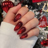 Red cat eye press-on nail design with magnetic shimmer on almond shape by Joyee Nails
