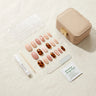 Reusable press-on nail kit with almond-shaped nude and tortoiseshell gel nails, adhesive tabs, nail glue, manicure stick, glass file, alcohol prep pad, and storage case — everything included in a Joyee Nails set for multiple wears.