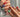 Colorful short squoval press-on nails with bright mixed summer shades — the universally flattering squoval nail shape shown on natural hands, handmade by Joyee Nails.