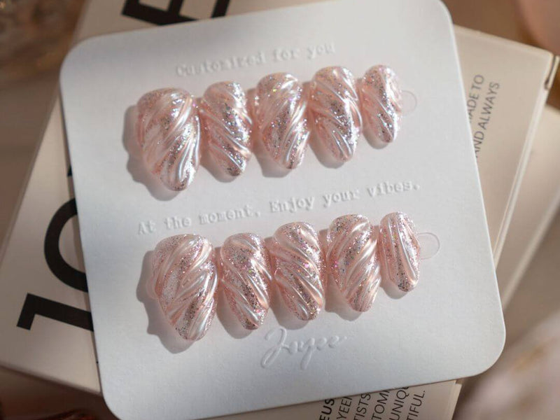 Extra short press-on nails from Joyee Nails showing detailed nail art on short nail lengths