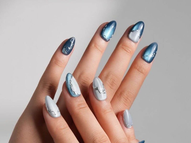 Icy blue and cool-toned chrome press-on nails from Joyee Nails H2O FlowBlue collection showing the 2026 blue nail trend