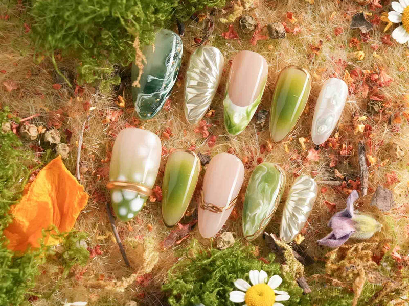 Sage green and botanical press-on nails from Joyee Nails Photosynthesis collection showing the 2026 nature-inspired nail color trend