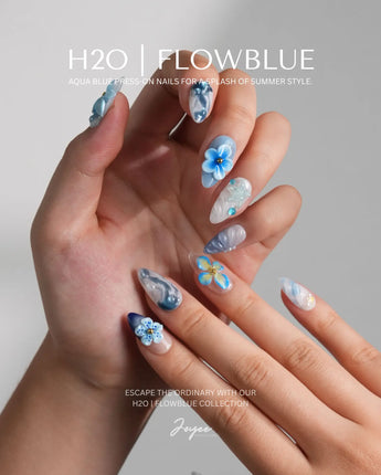 Bali Blue short almond press-ons with water ripple texture and sculpted blue flowers