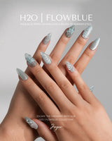 Close-up of Dead Sea Blue showing carved shell details, abalone flakes, and silver shimmer