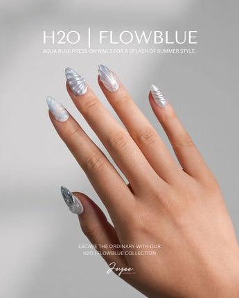 Great Barrier Blue underwater nails with seafoam gradients, chrome florals, and pearl finish