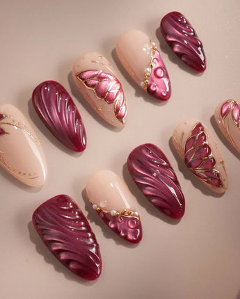 Velvet Flow handmade press-on nails featuring Sultry Berry Red, 3D Cat-eye Texture & Metallic Outlined Butterfly Wings.