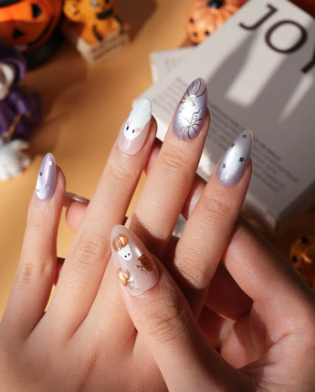 Twilight Pumpkin press on nails with chrome pumpkins, pastel ghosts and gold stars on lavender and copper cat eye - image 4