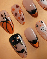 Monster Mash handmade Halloween press on nails with orange pumpkin, vampire, skeleton, stitches and bats on a sheer nude base - image 4