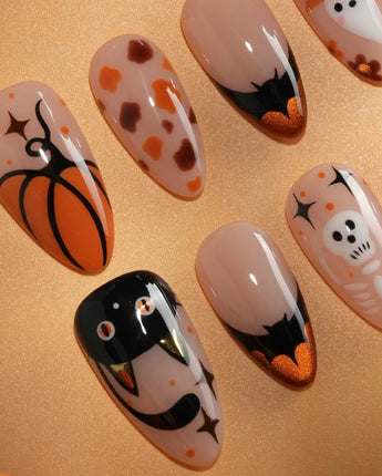 Monster Mash handmade Halloween press on nails with orange pumpkin, vampire, skeleton, stitches and bats on a sheer nude base - image 4
