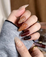 The Whole Fall press-ons with amber gradient color, syrupy 3D texture, and glossy finish