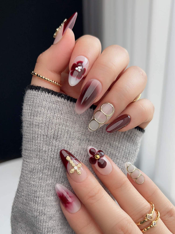 Tip Burgundy Nails with deep burgundy tips, milky white base, gold cross, and floral accents