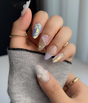 Aqua Petal dreamy pastel blue nails with sculpted flowers, butterflies, and glossy gel shine