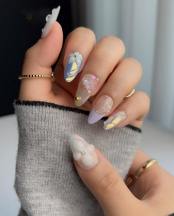Aqua Petal dreamy pastel blue nails with sculpted flowers, butterflies, and glossy gel shine