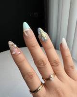 Aqua Petal handmade nails with pastel aqua shimmer, flowers, and delicate butterfly detail