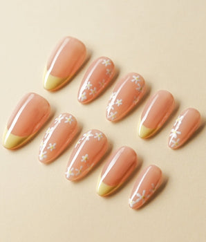 Petal Pop Spring Nails handmade press-on nails featuring yellow floral french tip nails