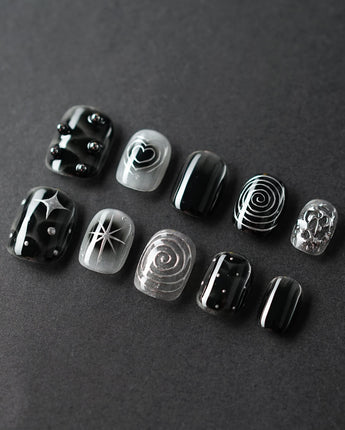 Black & Silver Void handmade press-on nails featuring black aura swirl abstract nails