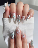 Miffy's Vacay handmade nails with silver chrome highlights and playful rabbit styling