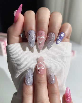 Charming Glam Usagi medium almond nails with soft playful details and polished gel shine
