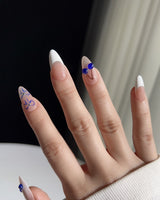 Klein Blue Cherry medium almond press-on nails with white French tips and blue cherry art