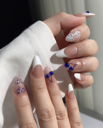 Klein Blue Cherry reusable nail set with clean white tips and graphic cherry accents