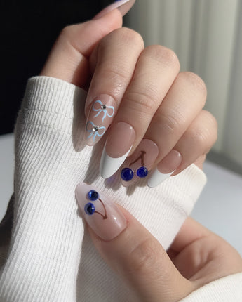 Close-up of Klein Blue Cherry showing glossy white tips and vivid blue cherry details