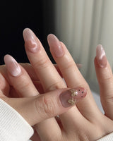 Thump Bunny glossy peach heart nails with playful bunny-inspired detail