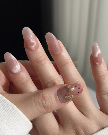 Thump Bunny glossy peach heart nails with playful bunny-inspired detail