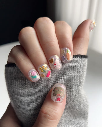 Squishy Pop reusable press-ons with fun pop-art details on extra short squoval nails