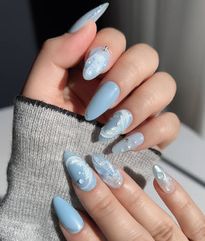 Mermaid Nail Designs Tale handmade almond nails with glossy blue sky and seashell details