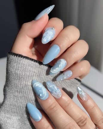 Mermaid Nail Designs Tale handmade almond nails with glossy blue sky and seashell details