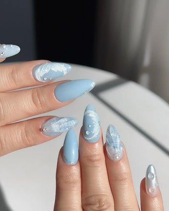 Mermaid Nail Designs Tale custom press-on set with pearly shell accents and soft sky blue finish