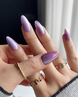 Purple planet nail art close-up showing Lavender Purple, Teal Shift Cat-eye details