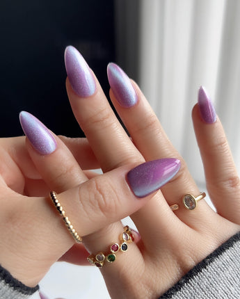 Purple planet nail art close-up showing Lavender Purple, Teal Shift Cat-eye details