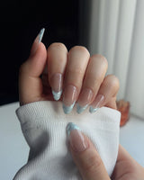 Close-up of Sea Salt showing delicate icy blue French tip nail art